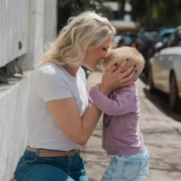 Tash Miller kissing Archie on the forehead