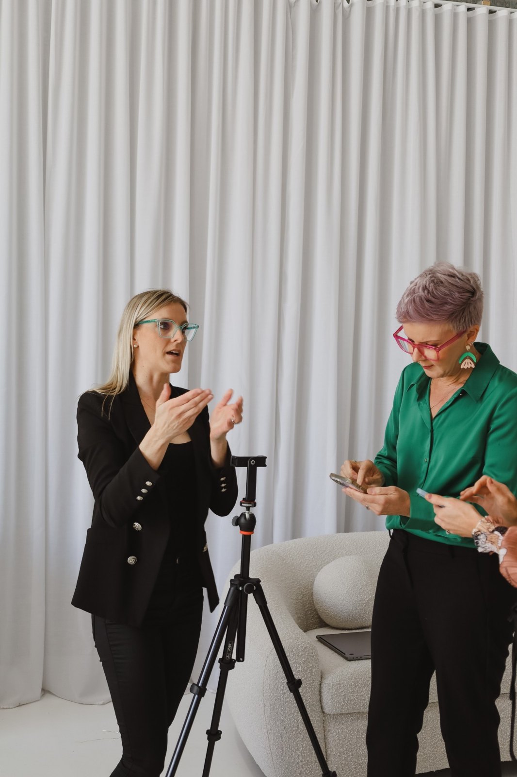 Tash Miller coaching workshop attendees on filming content with a phone and tripod